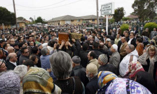 Funeral of mobile phone millionaire John Ilhan