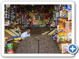 A man sitting in his shop in the Old Town, Sanaa.